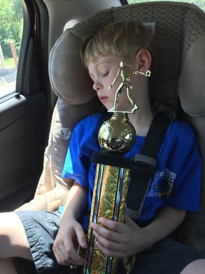 Caleb and his Horseshoe Trophy.jpg